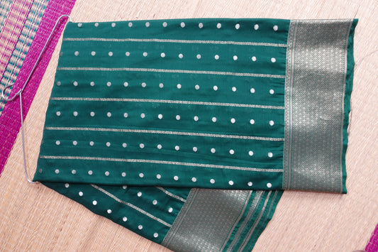 A bottle green colored crepe saree with 4-inch golden zari weaving (MCAUG131)