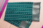 A bottle green colored crepe saree with 4-inch golden zari weaving (MCAUG131)