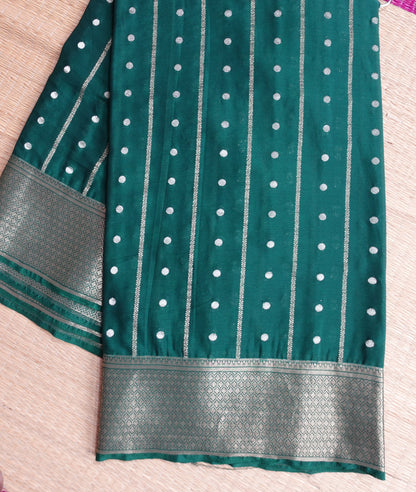 A bottle green colored crepe saree with 4-inch golden zari weaving (MCAUG131)
