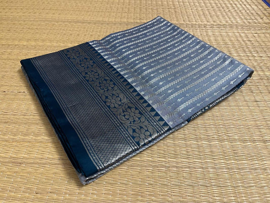 A cement colored Venkatagiri saree with Rama blue borders (VKG00036)